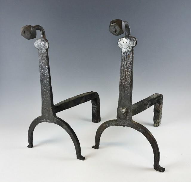 17th C. Hand Forged Iron Fireplace Andirons, (2pc): 17th C. hand made wrought iron fireplace andirons. Early form with faceted heads and peened supports. Good solid working condition with surface oxidation. Andirons measure: 16" H x 7" W x 16" D