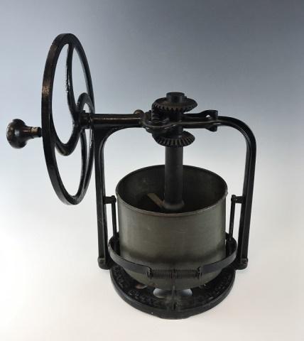 19th C. Hand Powered Mixer, Miller's Falls Co.: 19th C. cast iron hand driven four blade chopper, "MFGD BY MILLERS FALLS CO, MILLERS FALLS, MASS". Cast iron frame with hand crank wheel, galvanized steel vessel. Measures: 18.5" H x 14" W.