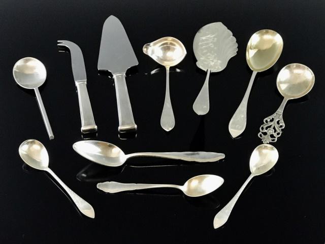 Collection, Danish, Continental Silver, (11pc): Collection of Danish and Continental silver flatware: (2) Pair of silver handled fish servers, (1) Dessert server marked "830", (3) Hand chased spoons with Danish assay, (1) Hand chased ladle signed "