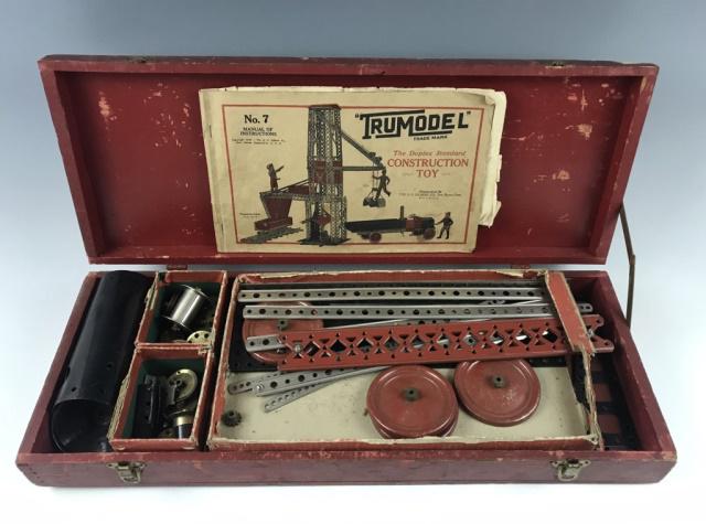 Vintage Toy Construction Set, TRUMODEL: Antique children's multi piece construction set in original fitted case, "TRUMODEL The Duplex Standard Construction Toy". Set with die stamped metal pieces with fasteners and detailed instruction and 