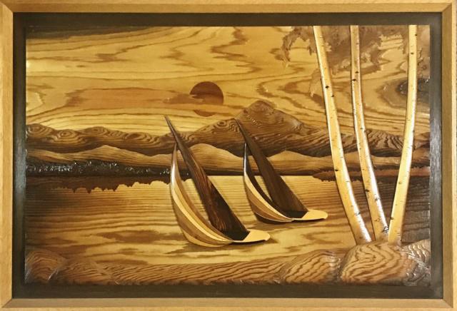 Hand Carved, Inlaid Wooden Artwork, R. Johnson: Vintage hand carved and inlaid wooden art panel, signed lower right corner "R. Johnson" (Robert W. Johnson). Scene of two sailboats with mountainous shore. Crafted in multiple wood types in a three-di