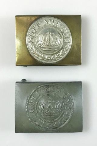 WW1 German Imperial Army Belt Buckles, (2pc): Two World War One German Army Belt Buckles: (1) Early war brass buckle with silvered central device of wreathed crown and "GOTT MIT UNS", reverse with double claw and catch, (1) Wartime field grey pai