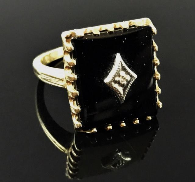 Art Deco 10K Gold, Onyx and Diamond Ring: Art Deco Style10K yellow gold ring, set with rectangular onyx panel with center set diamond, circa 1930. Ring size 6, Total weight 2.8 Dwt, 4.5 g.
