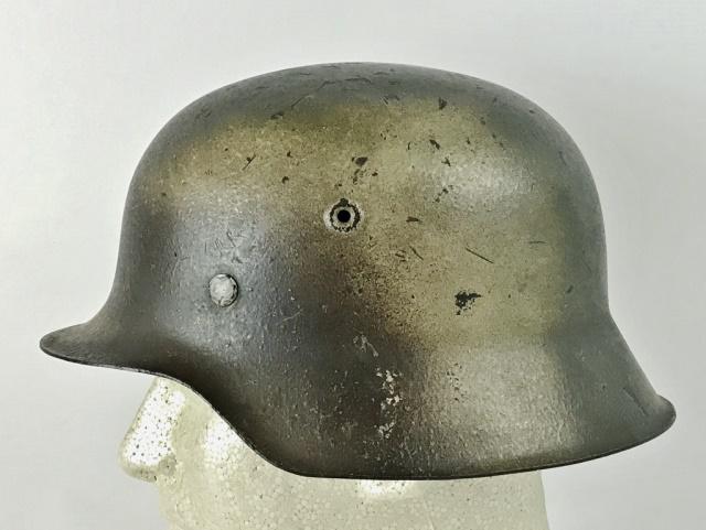 WW2 German Heer Camouflage Combat Helmet: World War Two German Heer M1942 Combat Helmet. Steel helmet with three color "Normandy" camouflage paint scheme in sprayed green, brown and tan, over original factory grey paint. Sharp rim with stampe