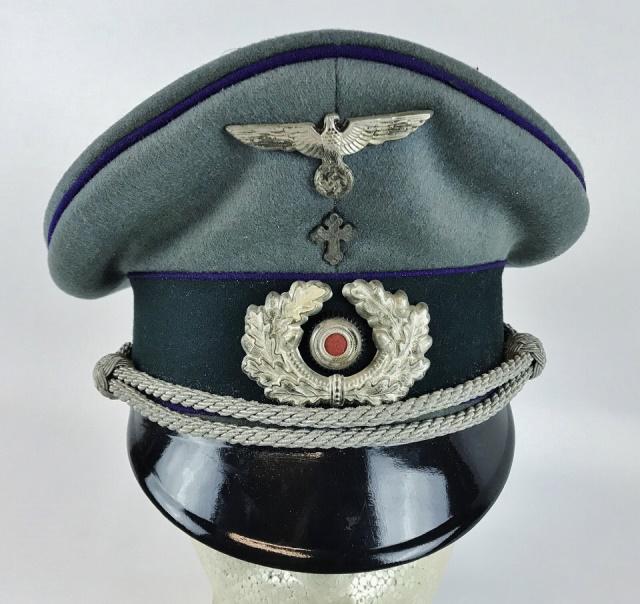 WW2 German Heer Chaplain Officer Visor Cap: World War Two German Heer Chaplain Officer visor cap. Quality grey-green wool construction with dark green band, purple piping, and black lacquered vulcanfibre visor. Braided silver bullion adjustable