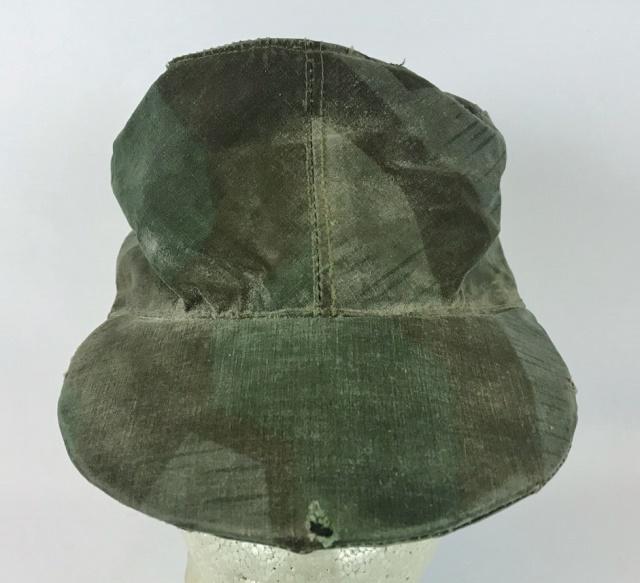 WW2 German Heer Camouflage Field Cap: World War Two German Heer Camouflage field cap. Constructed of printed cotton splinter pattern camouflage fabric. Interior lined in tab cotton twill with "57" size stamp in ink, illegible RNBr code an