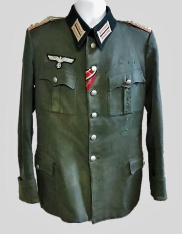 WW2 German Heer 130th Panzer-Lehr Officer Tunic: World War Two German Heer 130th Division Panzer Lehr Officer M1936 service tunic, insignia denotes rank of Lieutenant Colonel. Fine grey wool construction with four button flap pocket, six button fron