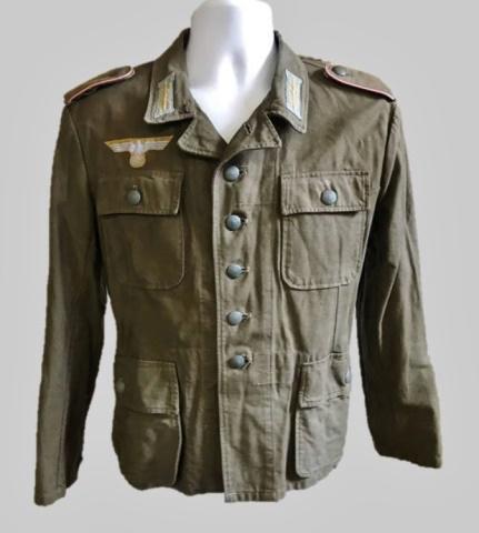 WW2 German Heer DAK Panzer EM / NCO Field Blouse: World War Two German Heer, Deutches Afrika Korps tropical EM / NCO field blouse. Constructed of cotton twill, with four pocket, five button front closure, interior with belt hooks and numerical depot