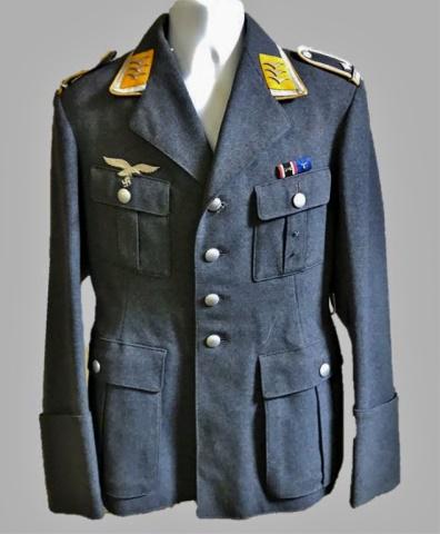 WW2 German Luftwaffe Flight NCO Field Tunic: World War Two German Luftwaffe Flight NCO M1935 field tunic, insignia denotes rank of Technical Sergeant. Constructed of blue grey wool with four pocket, four button front closure, French cuffs and la