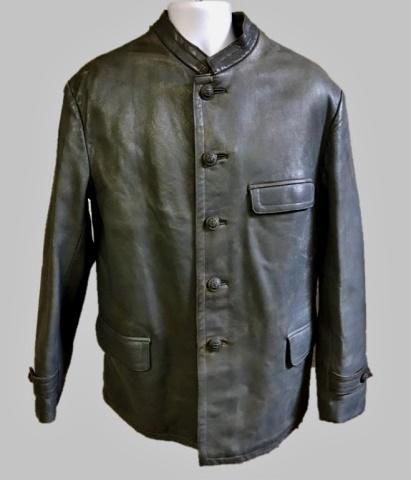 WW2 German Kriegsmarine Deck Uniform, (2pc): World War Two Kriegsmarine Deck Jacket and Pants. Jacket crafted of heavy grey leather with three pocket front, five button front closure with grey finished Kriegsmarine fouled anchor buttons. Interio