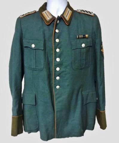 WW2 German Gendarmerie Officer Uniform (2pc): World War Two German Gendarmerie Officer M1938 uniform. (1) Service Tunic, insignia denotes rank of Meister. Constructed of quality blue wool with orange piped cuffs and collar with four pocket and ei