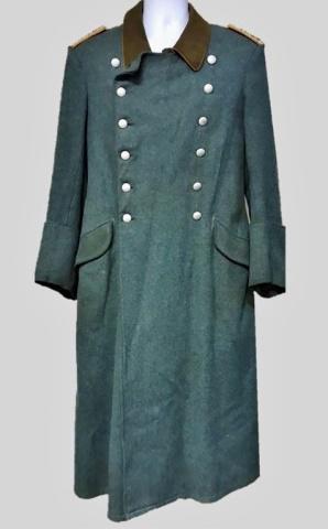 WW2 German Gendarmerie Officer Greatcoat: World war two Gendarmerie Officer Greatcoat, insignia denotes rank of Meister. Quality blue wool construction with twelve button double breasted front closure, orange piped brown wool lay down collar,