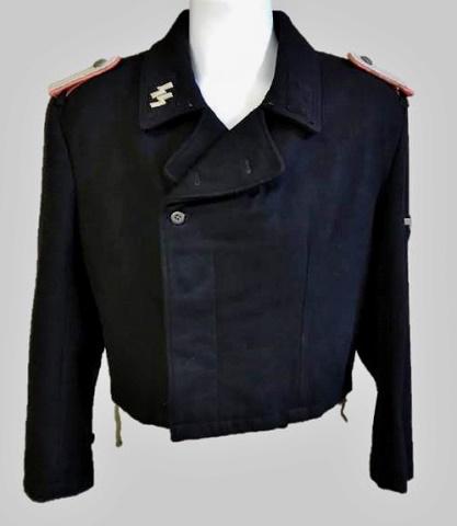 WW2 German SS Panzer Officer Assault Jacket: World War Two German SS Panzer Officer Assault Jacket, insignia denotes rank of Lieutenant. Black wool construction, nine button double breasted front closure with lay down collar. Interior with parti