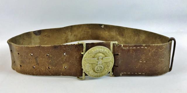 WW2 German NDSAP Leader Belt & Buckle: World War Two German NDSAP Party Leader Belt and Buckle. Die struck two piece gilt buckle with wreathed NDSAP eagle, reverse marked "RZM M4/27". Belt crafted in heavy brown leather with loop. Excellen