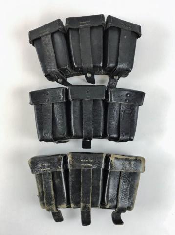 WW2 German Heer K98 Ammunition Pouches, (3pc): Three World War Two German K98 Ammunition Pouches. Black pebbled leather construction with three compartments and strap closure, reverse with suspension rings and belt loops. All three are marked with