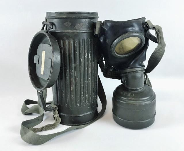 WW2 German Heer Gas Mask & Canister, (2pc): World War Two German Heer M1930 Gas Mask with Canister. Molded rubber gas mask marked "3" with plastic lenses, metal lower filter marked "BMW", cloth attachment straps. Fluted steel canister with oliv