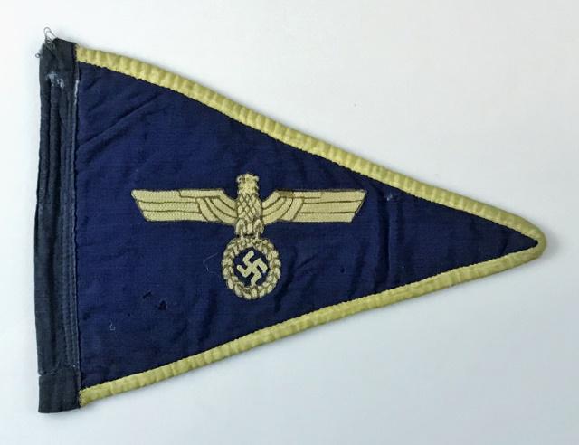 WW2 German Kriegsmarine Automobile Pennant: World War Two German Kriegsmarine Automobile Pennant. Blue filed with gold silk / rayon border, Kriegsmarine eagle in brown and gold thread, black fabric hoist. Good condition with wear and small repa