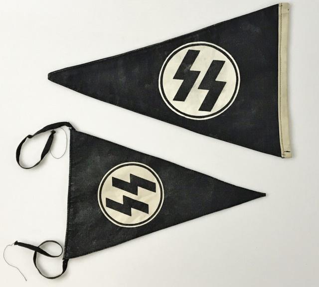 WW2 German SS Pennants, (2pc): World War Two German SS Pennants: (1) SS double sided automobile pennant constructed of heavy black cotton canvas with screen printed double sig runes in disk at center. (1) Small single sided light w