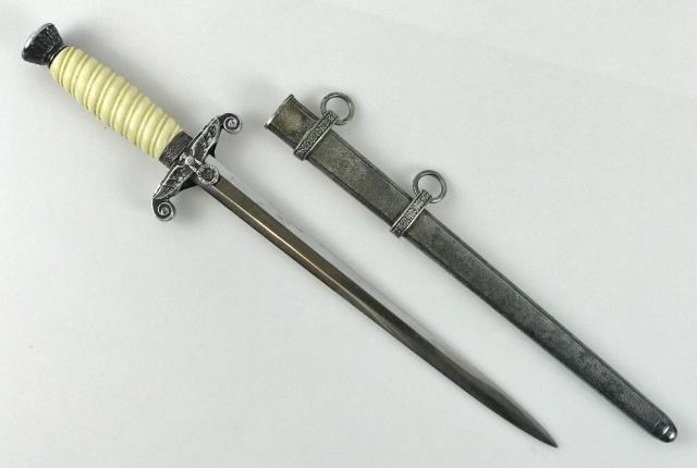 WW2 German Heer Officer Dagger, Alcosa: World War Two German Heer Officer dagger. Bright steel blade with etched maker's mark, "ALCOSA SOLINGEN" with scale logo. Eagle form cross guard with oak leaf decorated ferrule and pommel with silvere