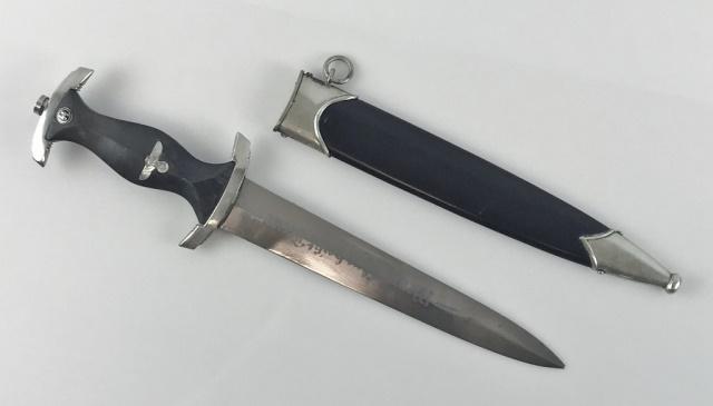 WW2 German SS EM / NCO Dagger RZM 941/38: World War Two German M1933 SS EM/NCO Dagger. Bright steel blade with deeply etched "Meine Ehre heist Treue" motton with etched maker code, "RZM 941/38 SS" (Carl Eickhoen) Nickel fittings with ebony wo