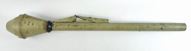 WW2 German Panzerfaust 100 (Inert): World War Two German Panzerfaust 100 M. Steel construction with ordinance tan painted surfaces. Tube with hinged firing mechanism, stamped with ordinance marks in ink, safety instructions stenciled re