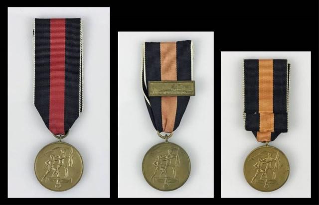 WW2 German October 1, 1938 Medals, (3pc): Three World War Two German October 1, 1938 Medals. Die struck alloy with bronze finish with tricolor ribbed silk ribbon. Excellent condition with wear and ribbon fading