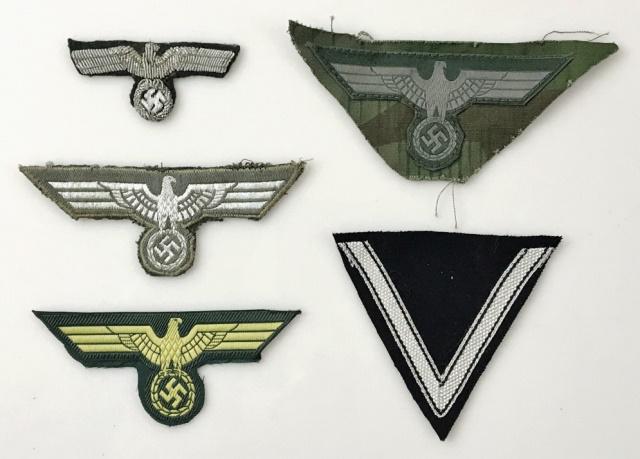 WW2 German Heer Insignia, (5pc): Collection of Six World War Two German Insignia: (2) Breast Eagles, embroidered on wool backing, (1) Bullion thread officer cap eagle, (1) BeVo woven eagle attached to camouflage fabric, (1) Sleeve ch
