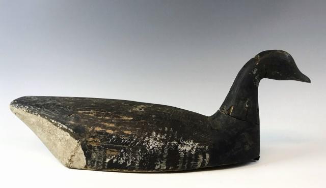 Antique Hand Carved Scoter Duck Decoy: 19th C. Hand Carved wooden Scoter Duck Decoy. Primitive form with hand painted surfaces, lead weight affixed to base. Decoy likely crafted in Long Island New York. Good condition with wear, measures 1