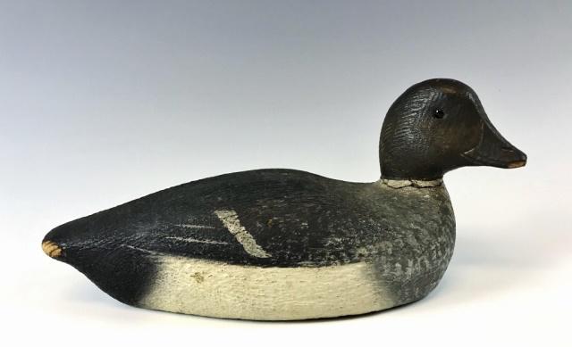Antique Cape Cod Carved Goldeneye Duck Decoy: Antique Hand Carved and Painted Hen Goldeneye Duck Decoy, found in Harwich, Massachusetts. Decoy with glass eyes and head feather detail. Excellent condition with original paint, measures: 14" L.