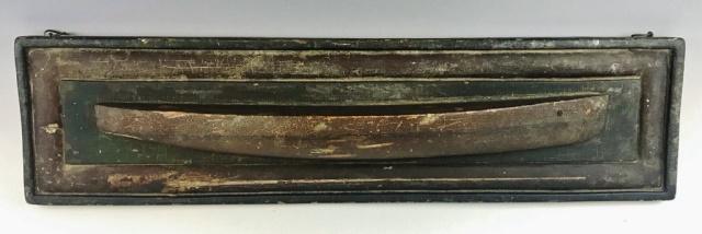 19th C. Shipbuilder's Half Hull Ship Model: Circa 1850 Antique hand carved and painted Shipbuilder's half hull. Wood hull mounted to hand carved board back with original paint. Excellent condition with wear to surfaces. Measures: 8" H x 31" L.