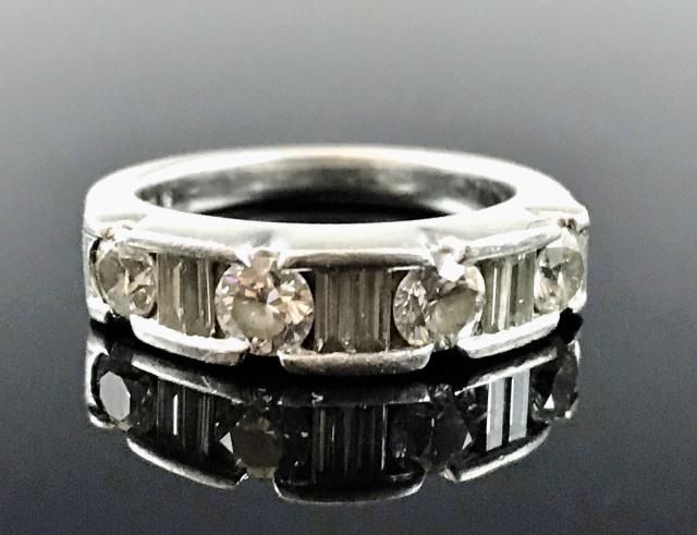 Ladies .950 Platinum Diamond Ring: Vintage ladies .950 platinum and diamond ring. Band style ring crafted of .950 platinum, set with six baguette cut diamonds and four modern round brilliant cut diamonds, well matched and of excellent