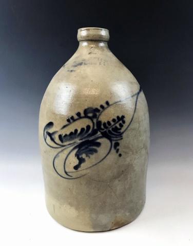 19th C. Stoneware Jug, Fort Edward N.Y.: 19th C. Stoneware Jug, signed "FORT EDWARD N.Y.". Salt glaze with hand decorated foliate design in cobalt. Good condition with wear and glaze craqueleur, measures: 14.5" H.
