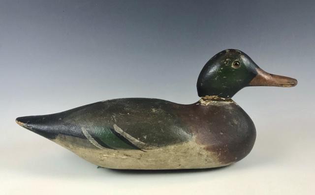 Antique Drake Mallard Duck Decoy, Mason: Antique Carved Wooden Drake Mallard Duck Decoy, Mason. Original factory paint with glass eyes with lead weight on base. Decoy with wear consistent with use in the field, measures: 7" H x 16" L.