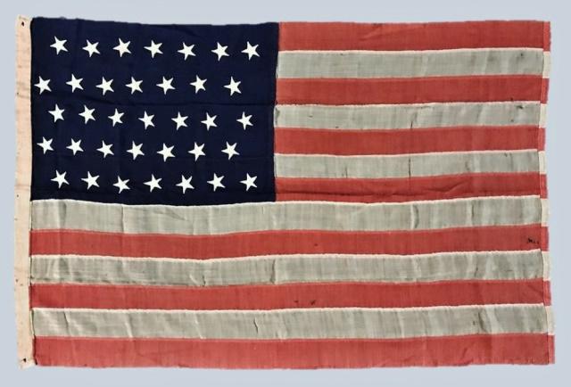 Civil War 35 Star American Flag 1863-1865: Civil War Thirty-Five Star American Flag, (1863-1865). Completely hand sewn wool construction with hand cut stars arrayed in five offset rows of seven stars each. Hoist with stitched grommet holes at 