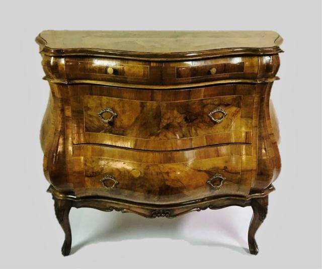 Antique Italian Olive Wood Bombay Style Chest: Early 20th C. Italian Bombay style chest of drawers crafted of olive wood. Four drawers, two over two with brass pulls. Base hand carved with floral decoration. Excellent condition, measures: 32" H x