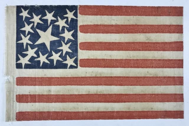 Fifteen Star American Parade Flag 1863-1865: Civil War Period Parade Flag Ca. 1863-1865. Fifteen star parade flag printed on coarse, glazed cotton. Stars arranged in medallion configuration with single center star, surrounded by 10 stars, with a
