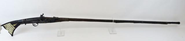 Antique North African Flintlock Moukhala Musket: Antique 18th - 19th C. North African Flintlock Moukhala Musket. Early snaphance mechanism, long barrel with carved wooden stock with wire and bone inlaid decoration. Fair condition with oxidation and