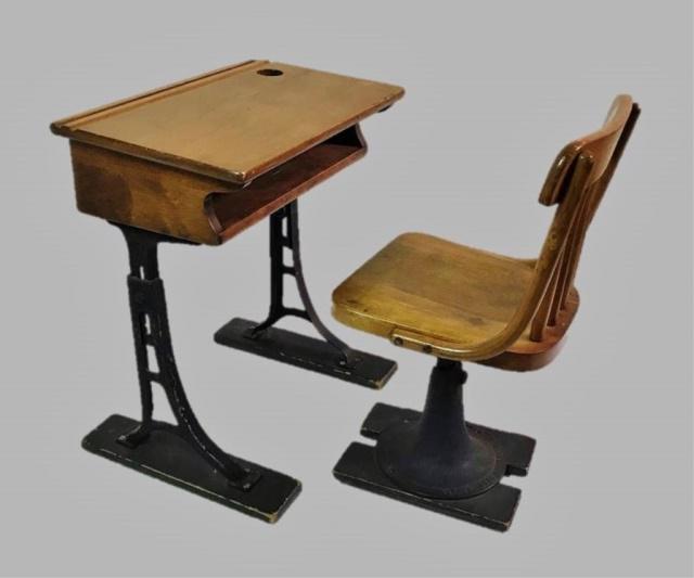 Antique School Desk, Kenney Bros. Wolkins (2pc): Early 20th C. Child's School Desk. Wood top and seat, with cast iron bases, chair base signed "KENNEY BROS. WOLKINS BOSTON MASS." Good condition with wear, measures: 24.5" H x 21" W x 13" D.