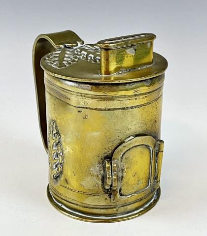 19th C. Jewish Brass Charity Box, Russia: 19th C. Brass Jewish Charity Box, Russian. Heavy brass tankard form with coin slot at lid, foliate decoration and hinged latched door at base. Excellent condition with wear, measures: 5" H x 4.75" W.