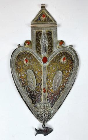 Antique Torah Breast Plate, North Africa: 18th - 19th C. Torah Breastplate, Likely North Africa. Heart form, crafted of silver with gilt, hand chased foliate and inset filigree decoration, set with polished cabochon stones. Plate terminates w