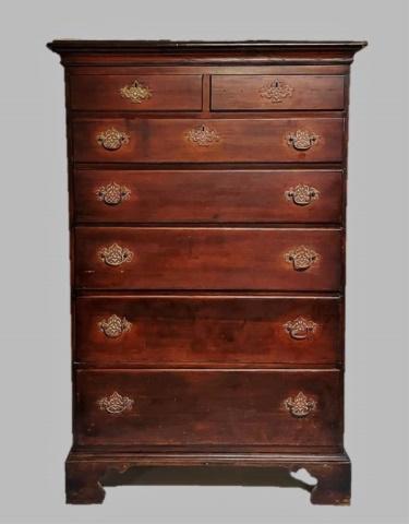 18th C. New England American Cherry Tall Chest: 18th C. American New England Tall Chest. Cherry wood construction with two over five graduated drawers on bracket base. Dovetailed chamfered drawers with brass Chippendale style reticulated brasses an