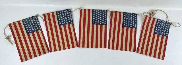 String of Five 45 Star American Flags 1896-1908: Five Strung Forty-five Star American Flags, 1896-1908. Flags crafted of printed linen, attached to cord. Excellent condition, measures: 84" L, flags: 12" H x 8" W.