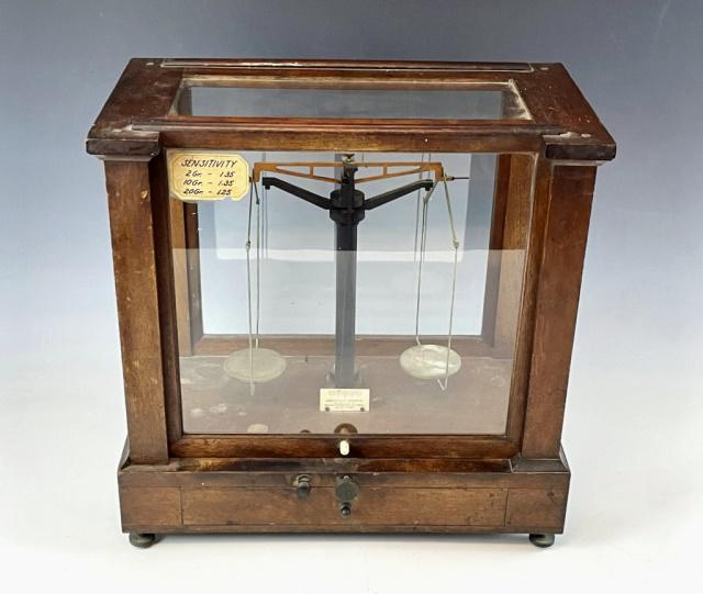 Antique Cased Scientific Scale, Christian Becker: Antique Cased Scientific Scale, signed "Christian Becker, New York". Glazed wooden case with sliding window, and lower drawer. Interior housing adjustable beam scale. Good condition, case with one ope