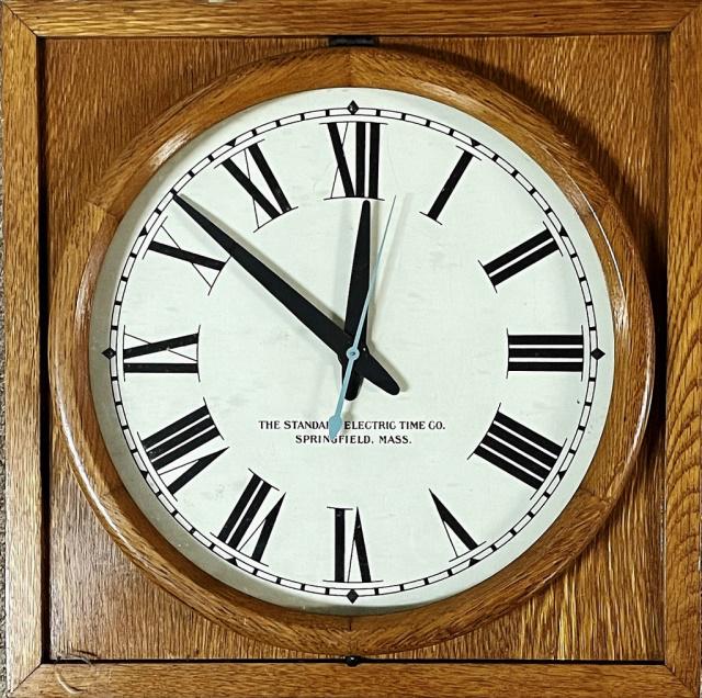 Antique Wall Clock, American Electric Time Co.: Antique Wall Clock, Signed "American Electric Time Co.". Oak case with white face with Roman numeral radial dial with minute and seconds hand. Movement electric driven. Good condition, measures: 15.75