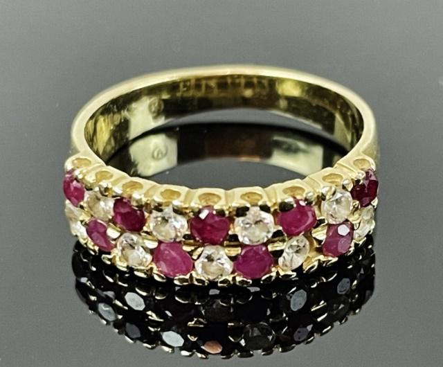 Ladies Italian 14K Gold Diamond, Ruby Ring: Ladies Italian 14K Gold Diamond and Ruby Ring. Crafted of 14K yellow gold set with nine small well matched round cut diamonds and nine round cut rubies. Ring size: 5, total assembled weight: 1.9 Dwts,