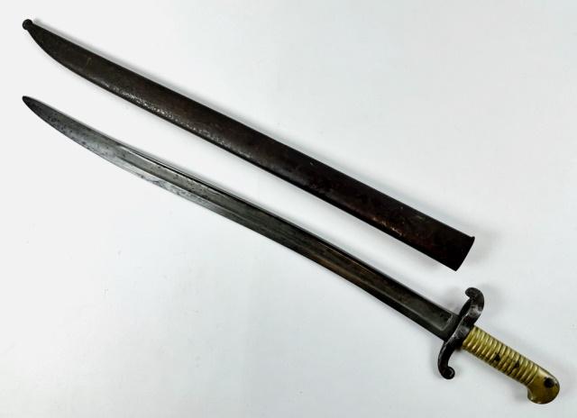 French M 1842 Saber Bayonet, Mutzig 1848: French Model 1842 Saber Bayonet, Signed "MUTZIG 1848". Single fullered steel yatagan style blade signed with military proofs at ricasso. Steel guard with cast brass grip with spring release button. Ac