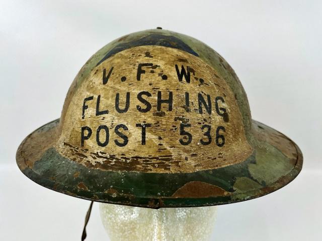 WW1 U.S. M1917 Doughboy Helmet, VFW Flushing 536: World War One U.S. Model 1917 "Doughboy" Combat Helmet, Camouflage Paint with "V.F.W. FLUSHING POST 536". Six color hand painted splinter style camouflage scheme with rough sand finish. Interior with 