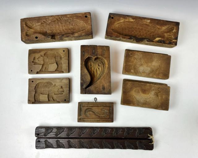 Antique Wooden Maple Sugar Molds (10pc): Collection of 19th C. Wooden Maple Sugar Candy Molds. Four pairs and two singles, molds of fish, rhinoceros, birds, geese, heart and "s" design. Good condition with wear. Largest measures: 4" H X 11" 