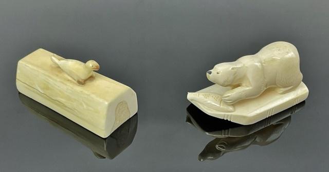 Inuit Carved Walrus Figures (2pc): Two Inuit Native Carved Walrus Figures: Carved tusk with a small seal figure at top, (1) Polar Bear figure with fish, base with old paper tag. Good condition, larger measures: 1.75" H X 2" W X 3.5" D.