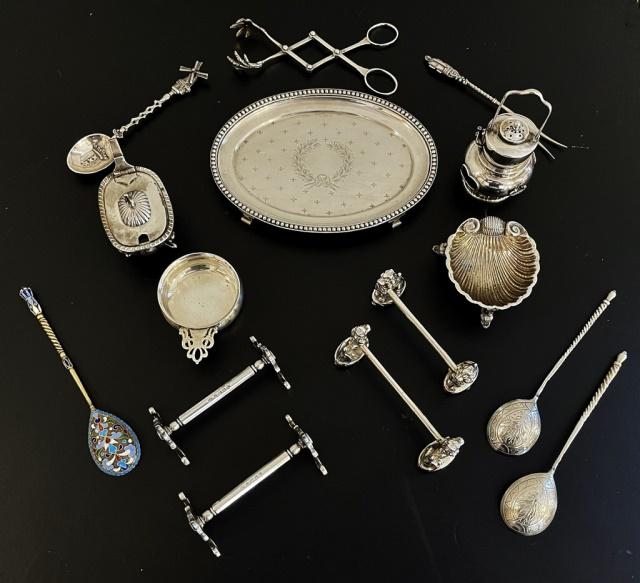 Collection, Sterling and .800 Silver Smalls (14pc): Collection of Fourteen .800 and Sterling Silver Smalls: (2) Lion form knife rests, (2) Scroll ended knife rests with British hallmarks, (1) Open shell form salt with dolphin legs, (1) Covered salt wit